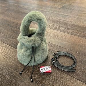 Moss green faux fur bucket bag with detachable crossbody straps